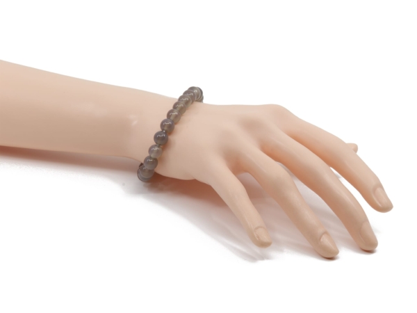 Agate gemstone bracelet shown worn on the wrist with shiny grey beads