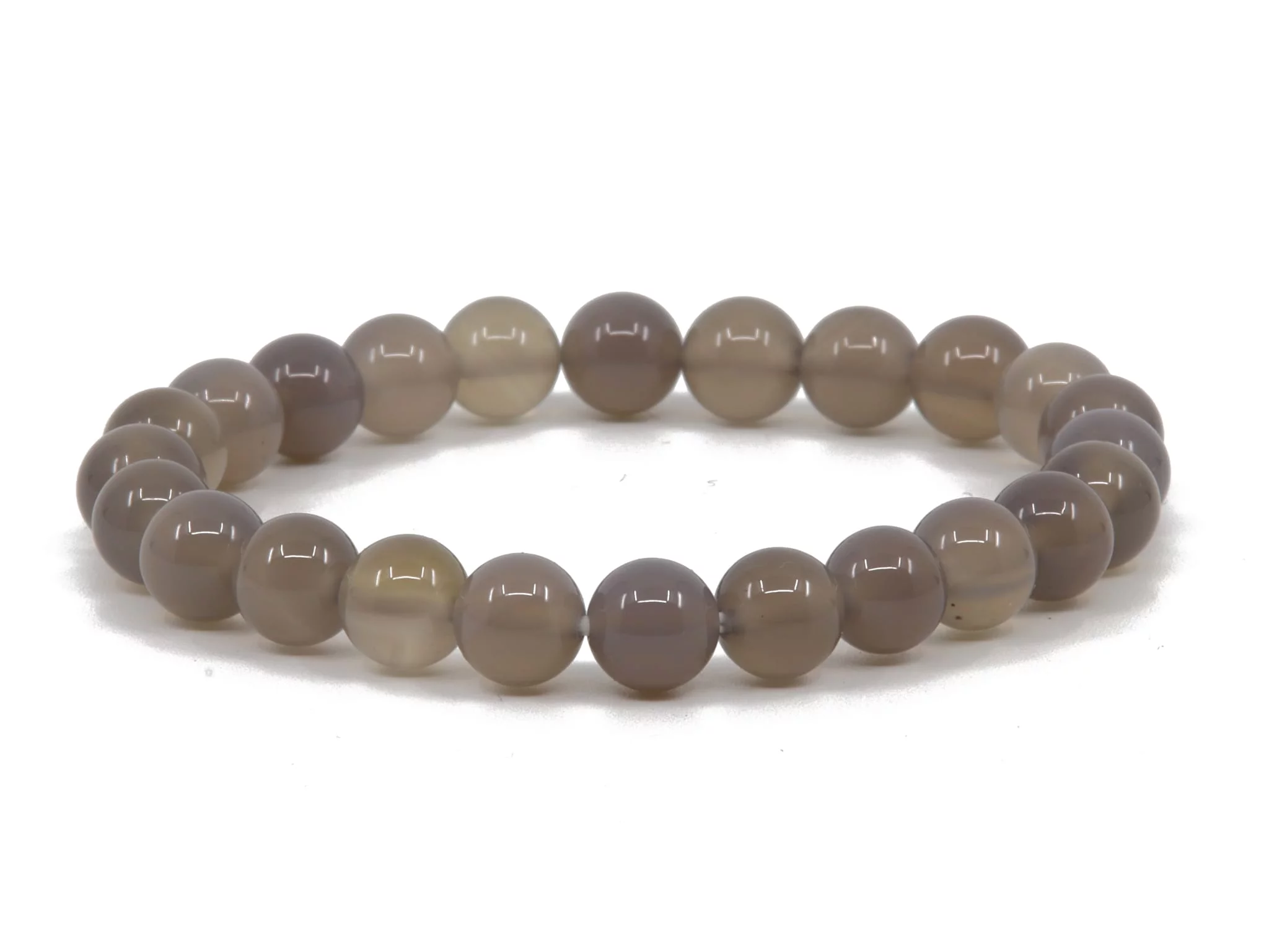 Agate gemstone bracelet in close-up with naturally grained grey-brown beads