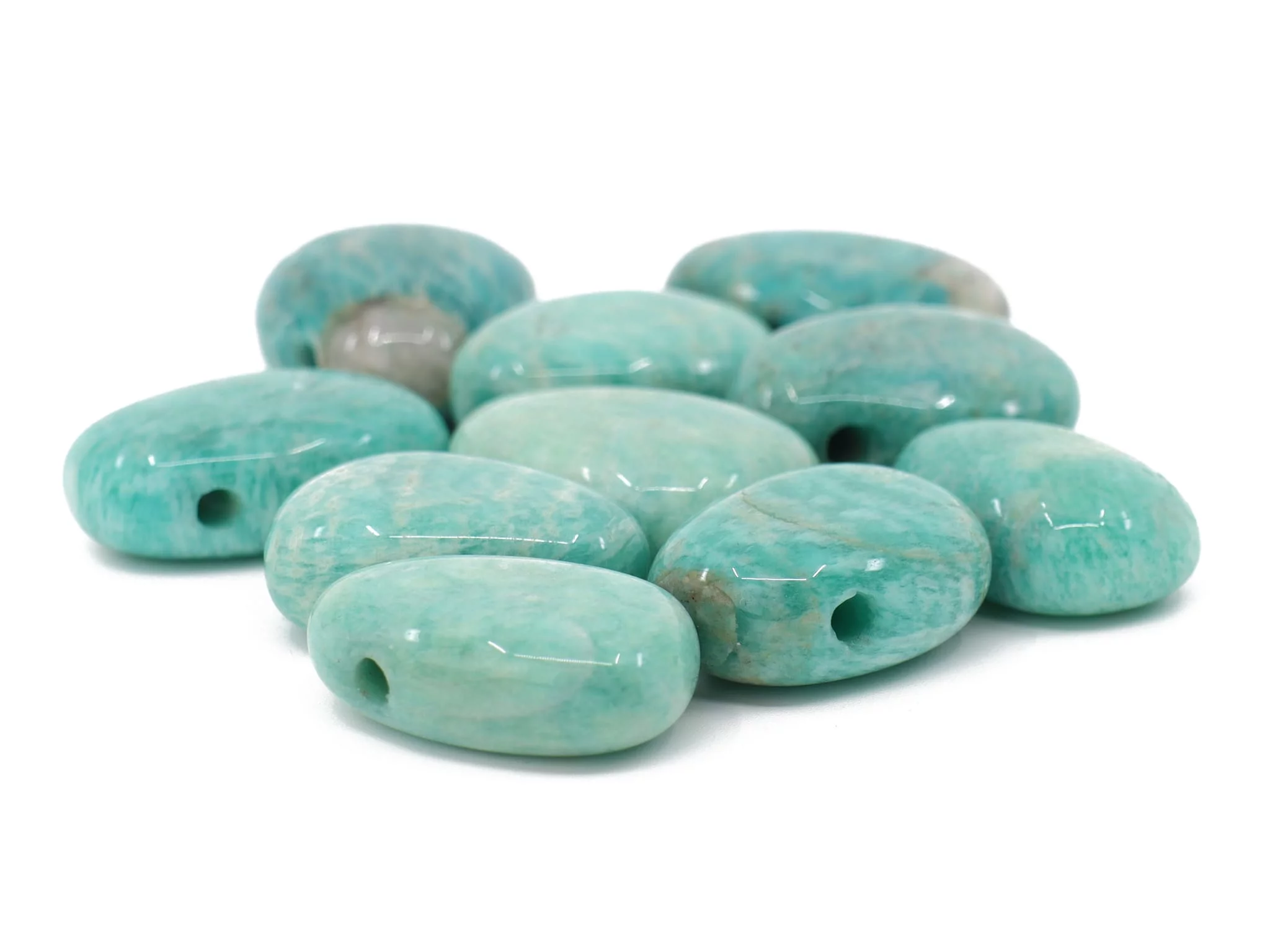 Amazonite gemstone pendant as a selection of several polished greenish tumbled stones