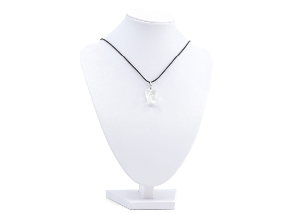 Clear quartz angel pendant on a black necklace on a white jewellery stand
