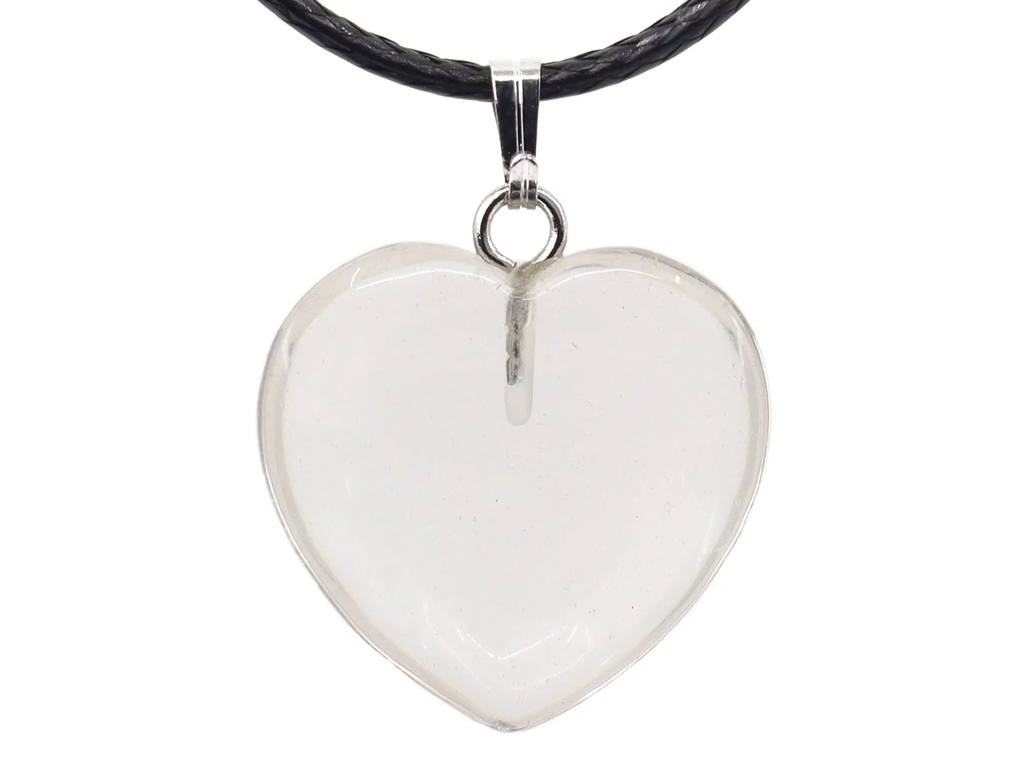 Close-up of rock crystal heart gemstone pendant with metal bail and black leather cord