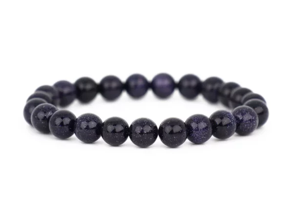 Blaufluss Armband mit dunkelblauen glitzernden Kugeln auf weissem Hintergrund in Frontansicht
