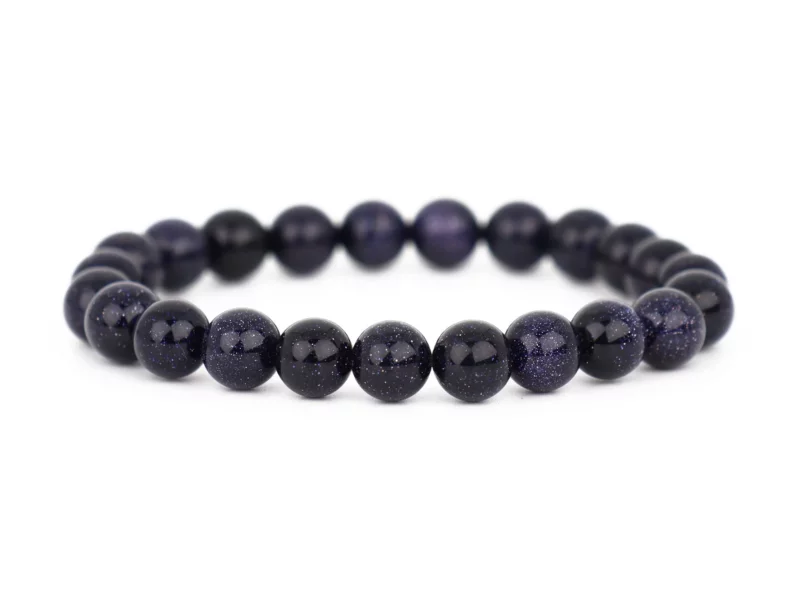 Bracciale blufluss con sfere blu scuro scintillanti su sfondo bianco, vista frontale