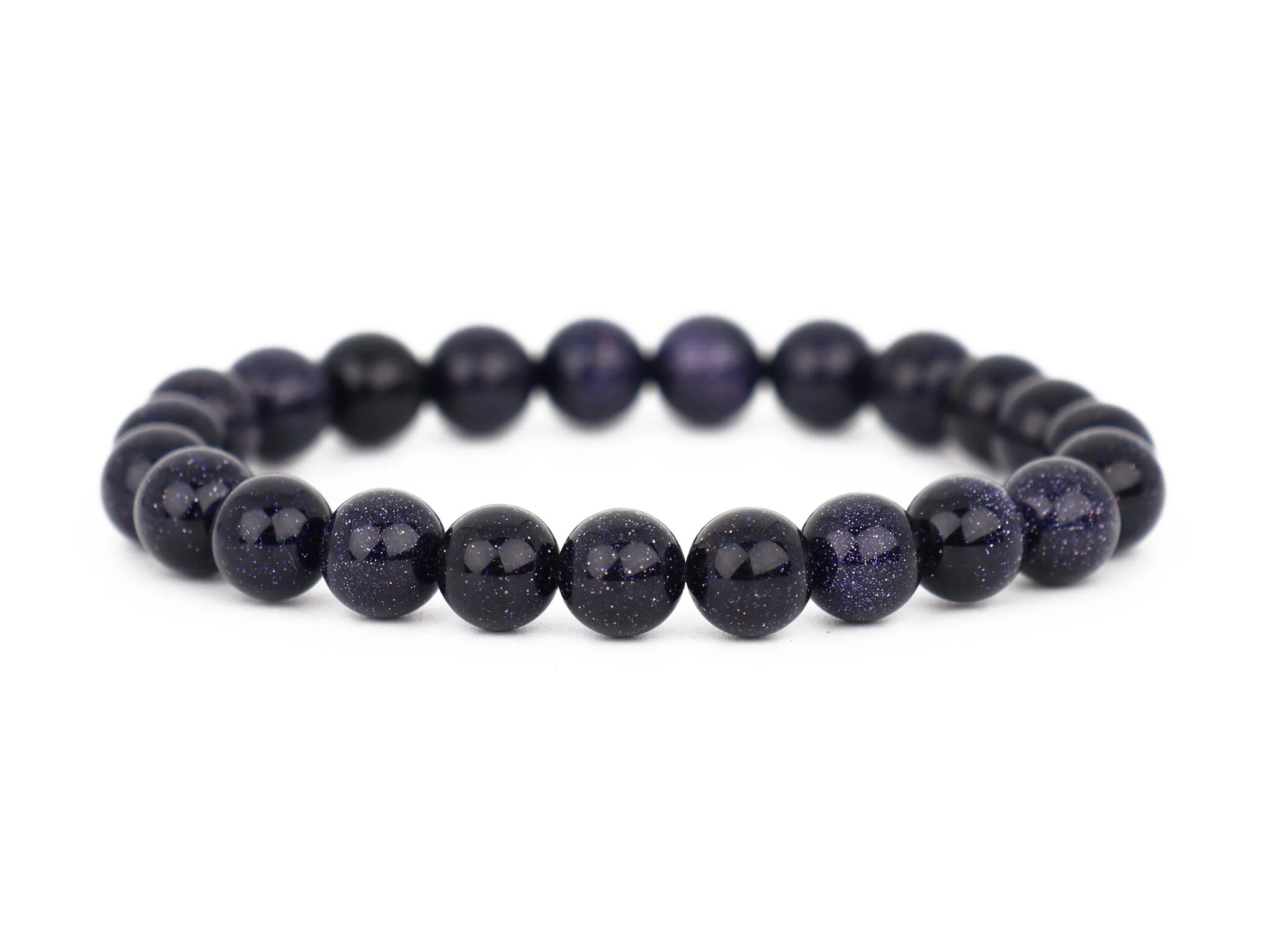 Blaufluss Armband mit dunkelblauen glitzernden Kugeln auf weissem Hintergrund in Frontansicht