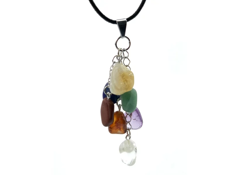 Chakra gemstone pendant with seven colourful tumbled stones on a black necklace against a white background