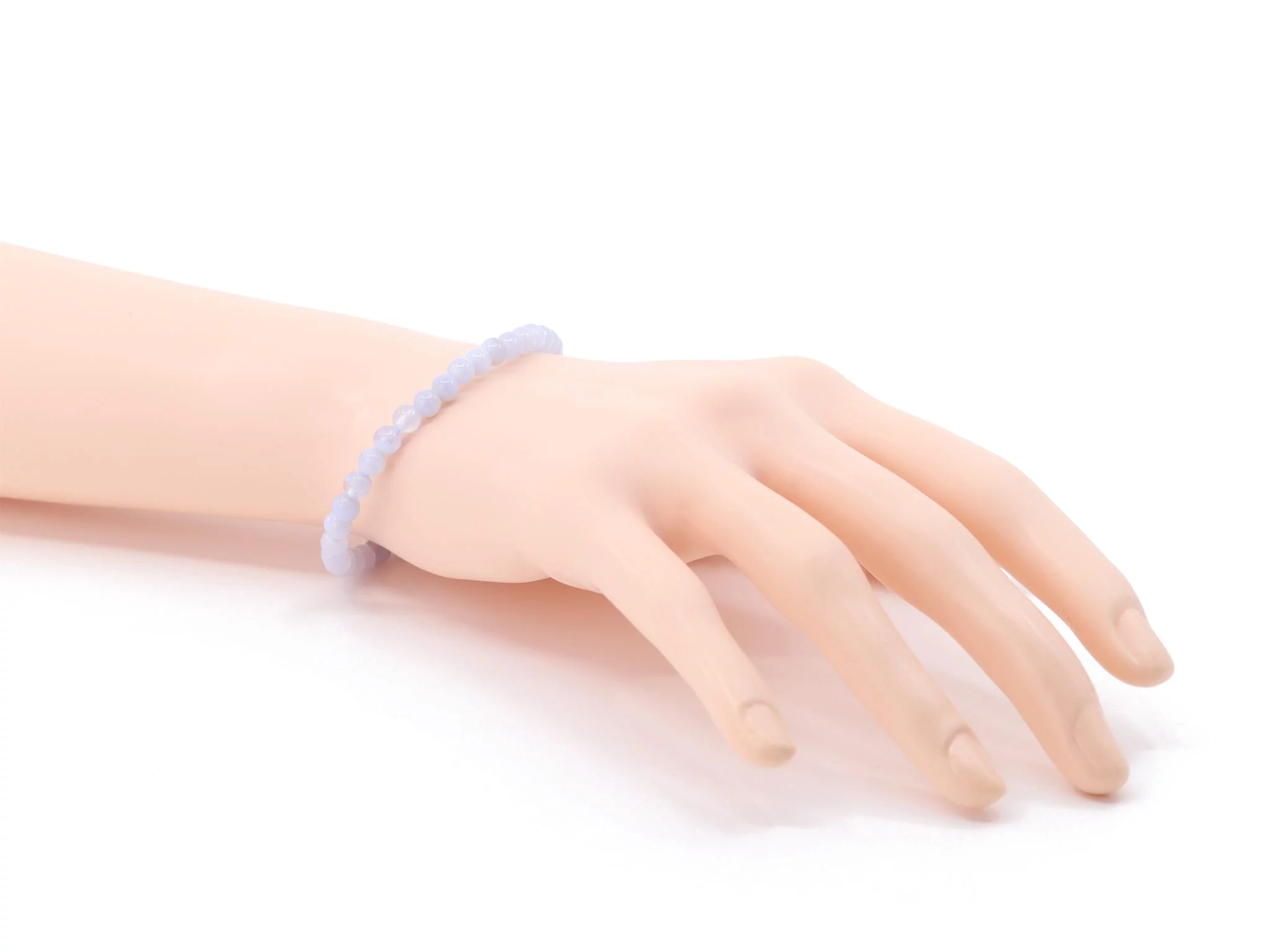 Chalcedony gemstone bracelet worn on the wrist with light blue beads