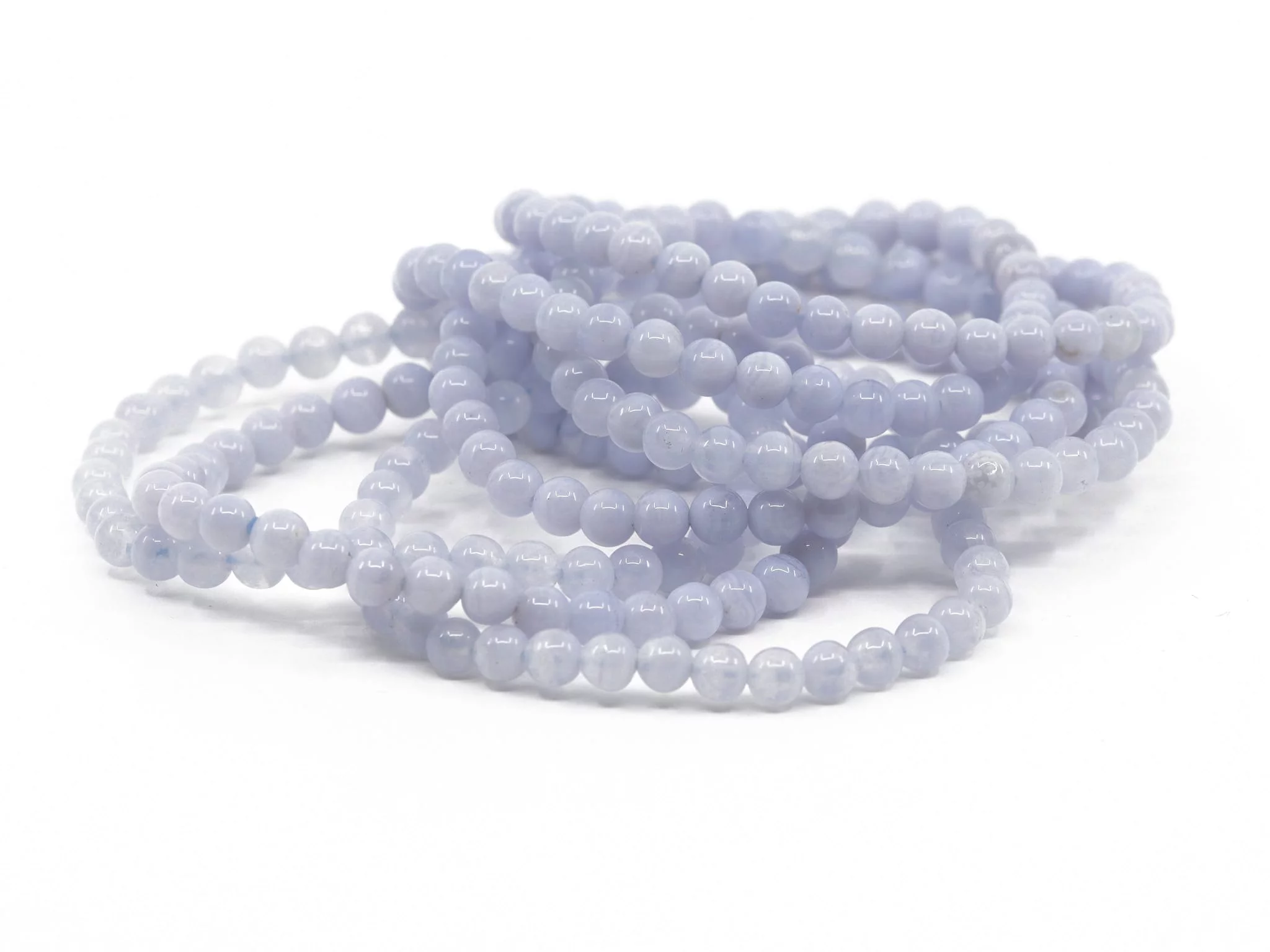 Chalcedony gemstone bracelets with polished light blue beads in a stacked view