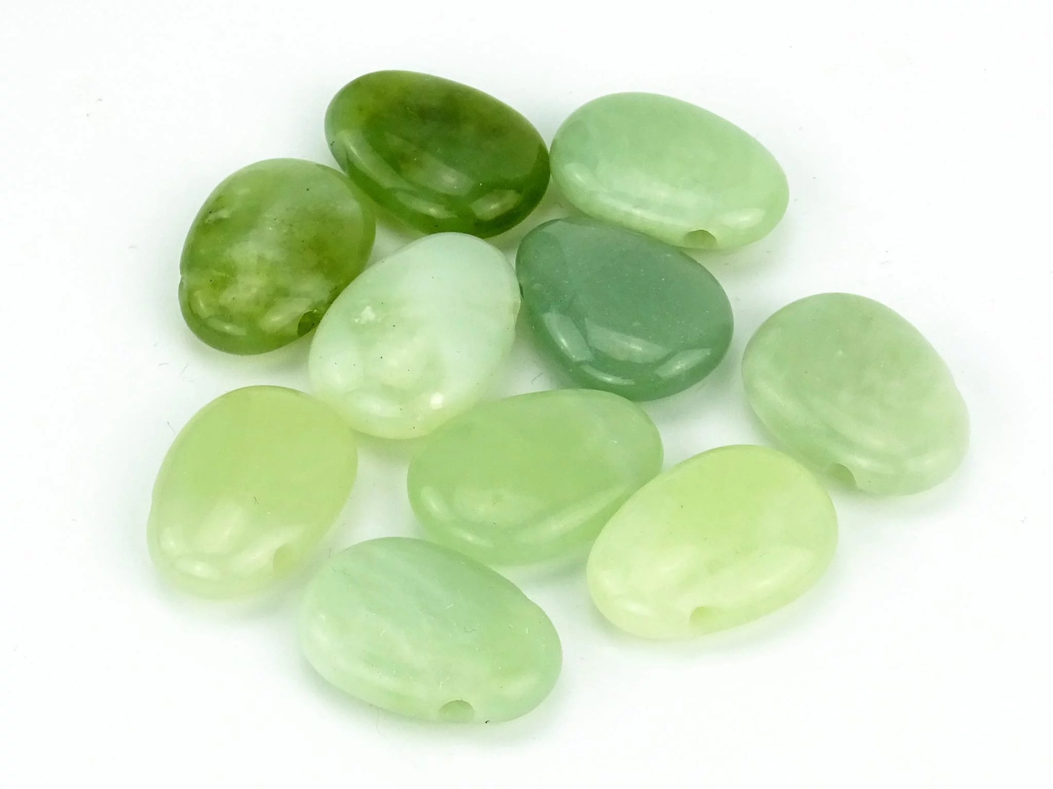 China Jade gemstone pendant with different green color nuances and bores