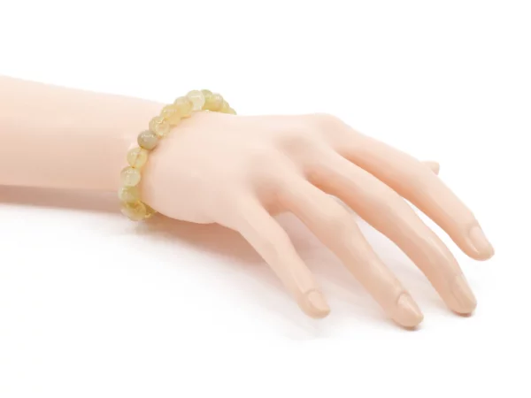 Citrin Edelsteinarmband als Trageansicht am Handgelenk mit hellgelben Kugeln