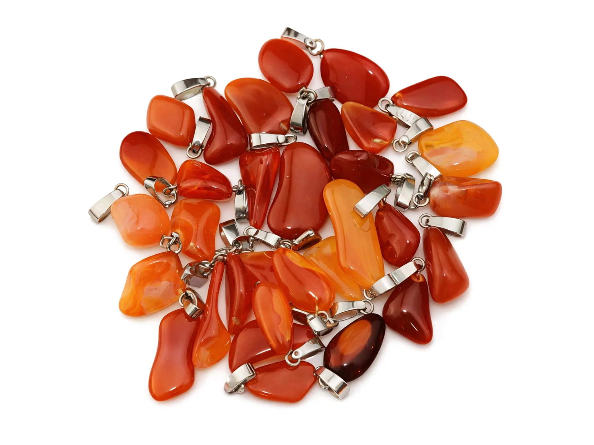 Fire opal gemstone pendant as a selection of differently shaped orange-red stones