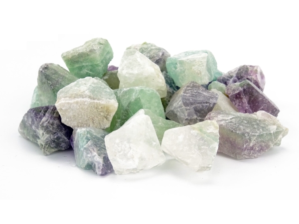 Fluorite water stones with raw surface in green, purple, and white in close-up view