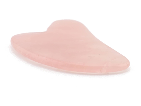 Rose quartz gua sha massage stone in a flat side view with gently rounded massage edges