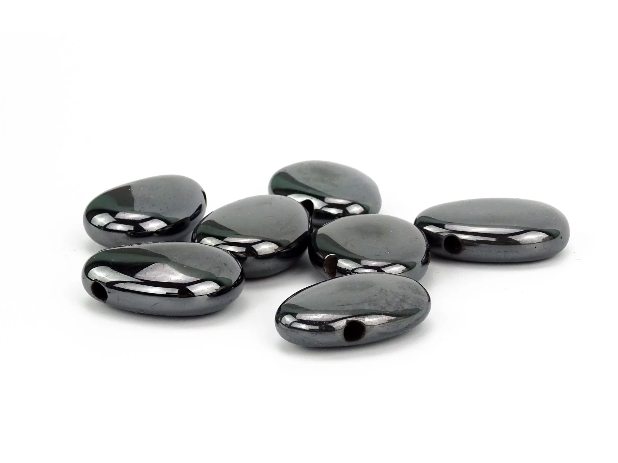 Pierres percées en hématite en vue de sélection sombre brillante