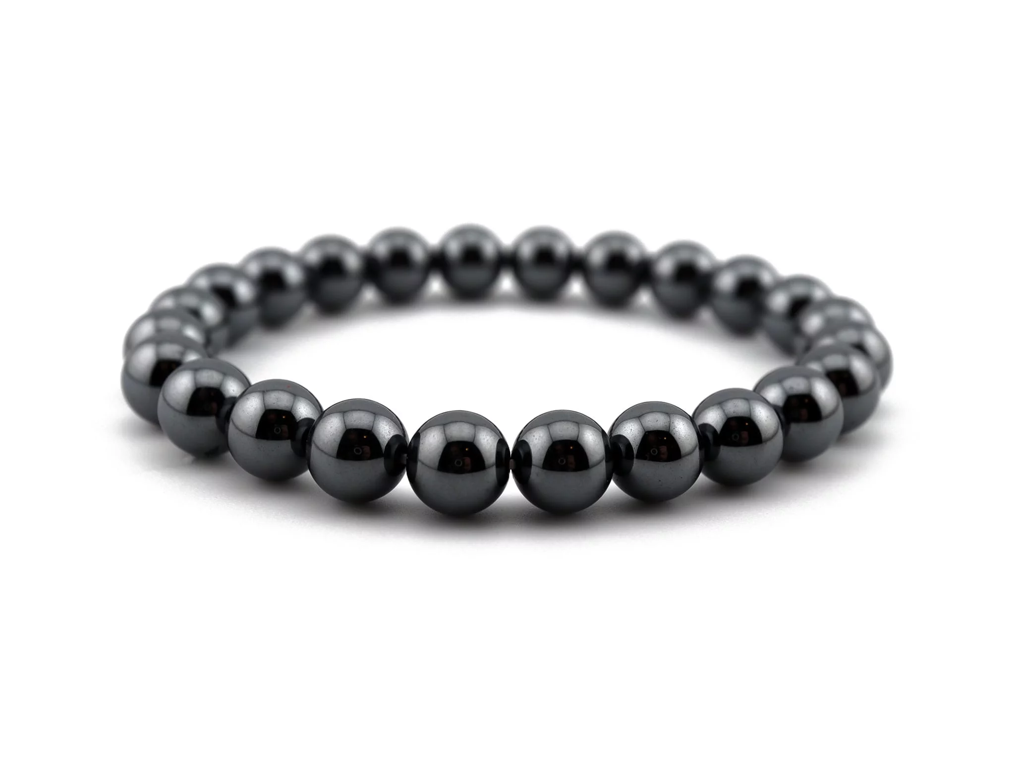 Hematite gemstone bracelet with shiny dark gray beads in diagonal front view on white background