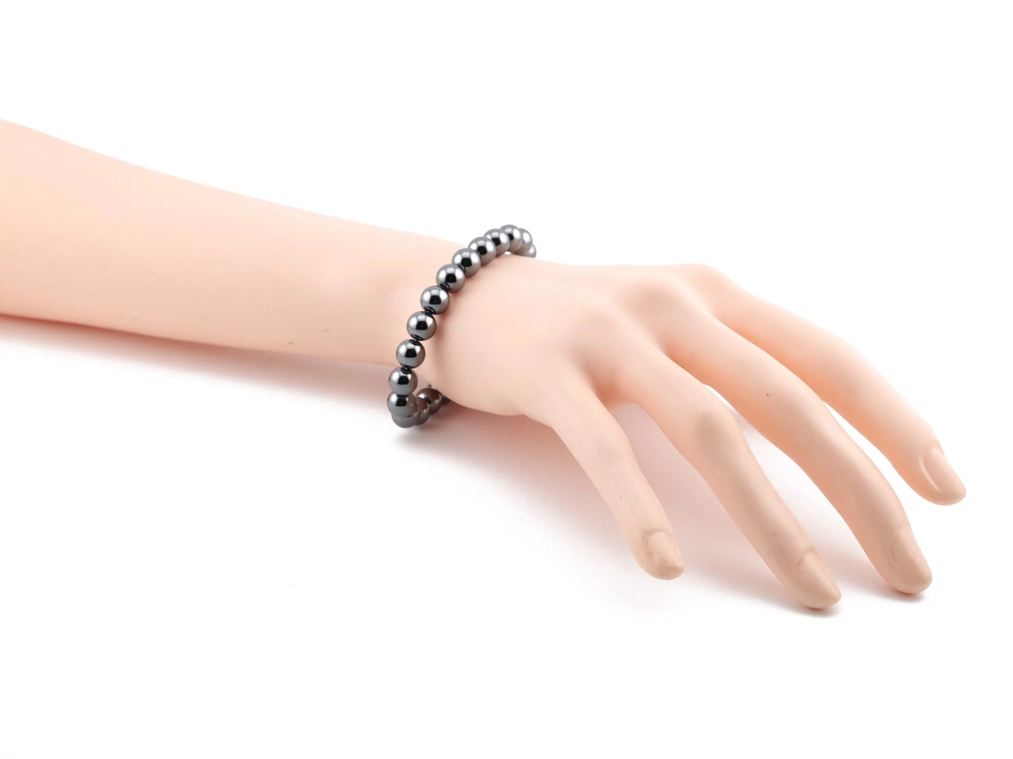 Hematite gemstone bracelet worn on wrist with metallic shiny beads
