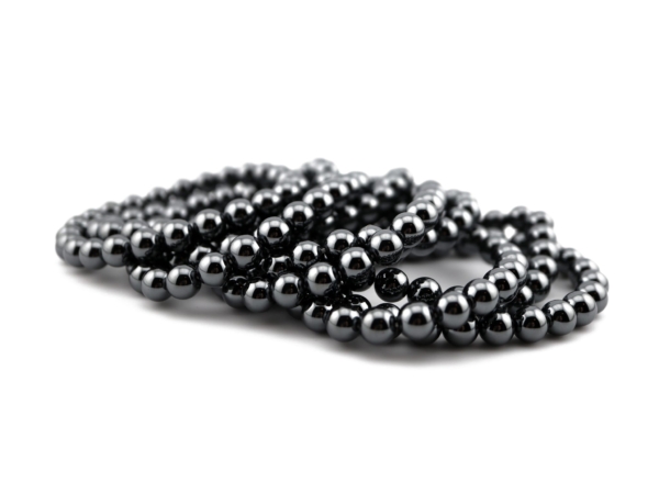 Hematite gemstone bracelets with polished dark gray beads in stacked detail view