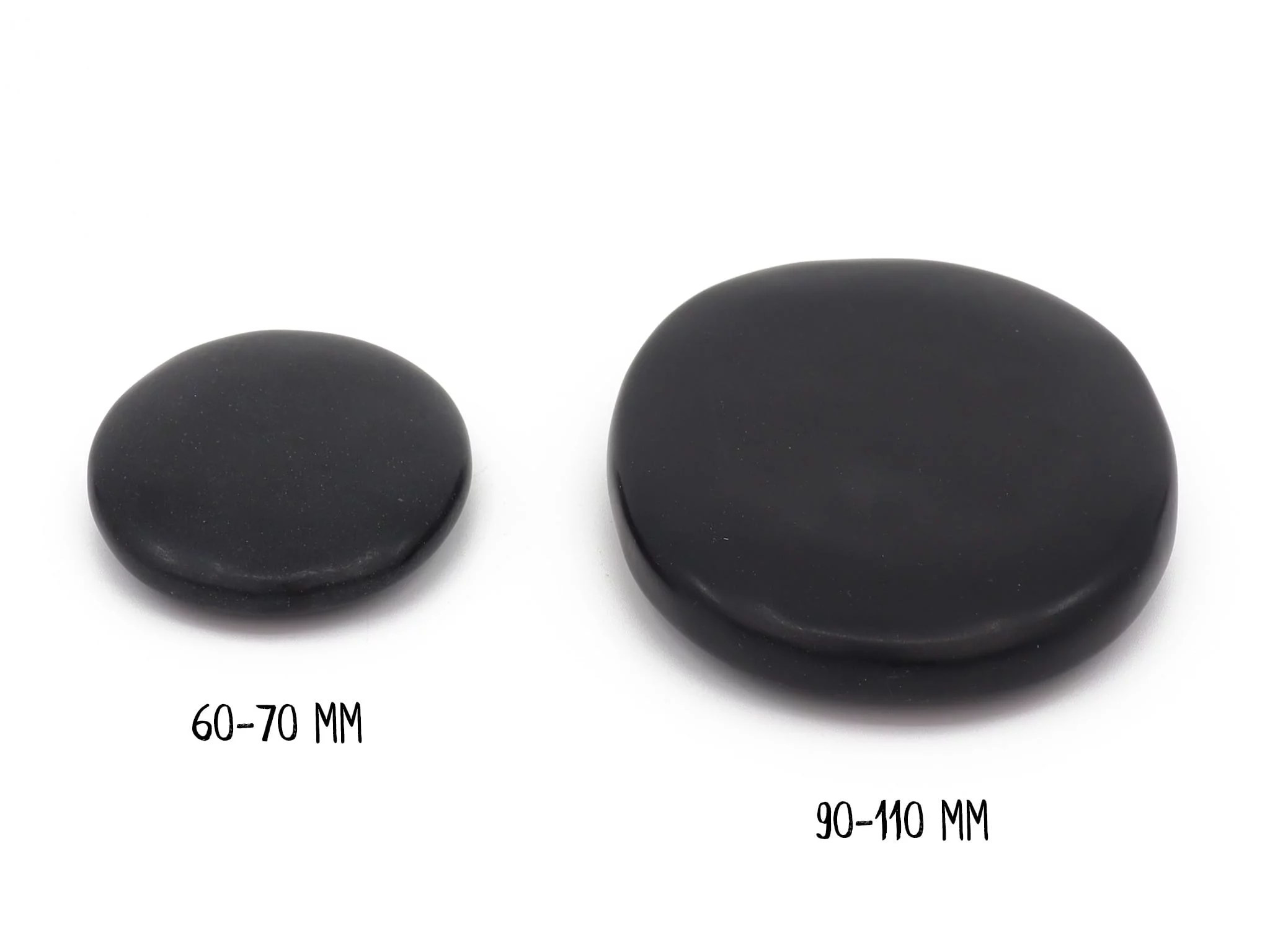 Basalt Hot Stone massage stones in direct size comparison with 60–70 mm and 90–110 mm