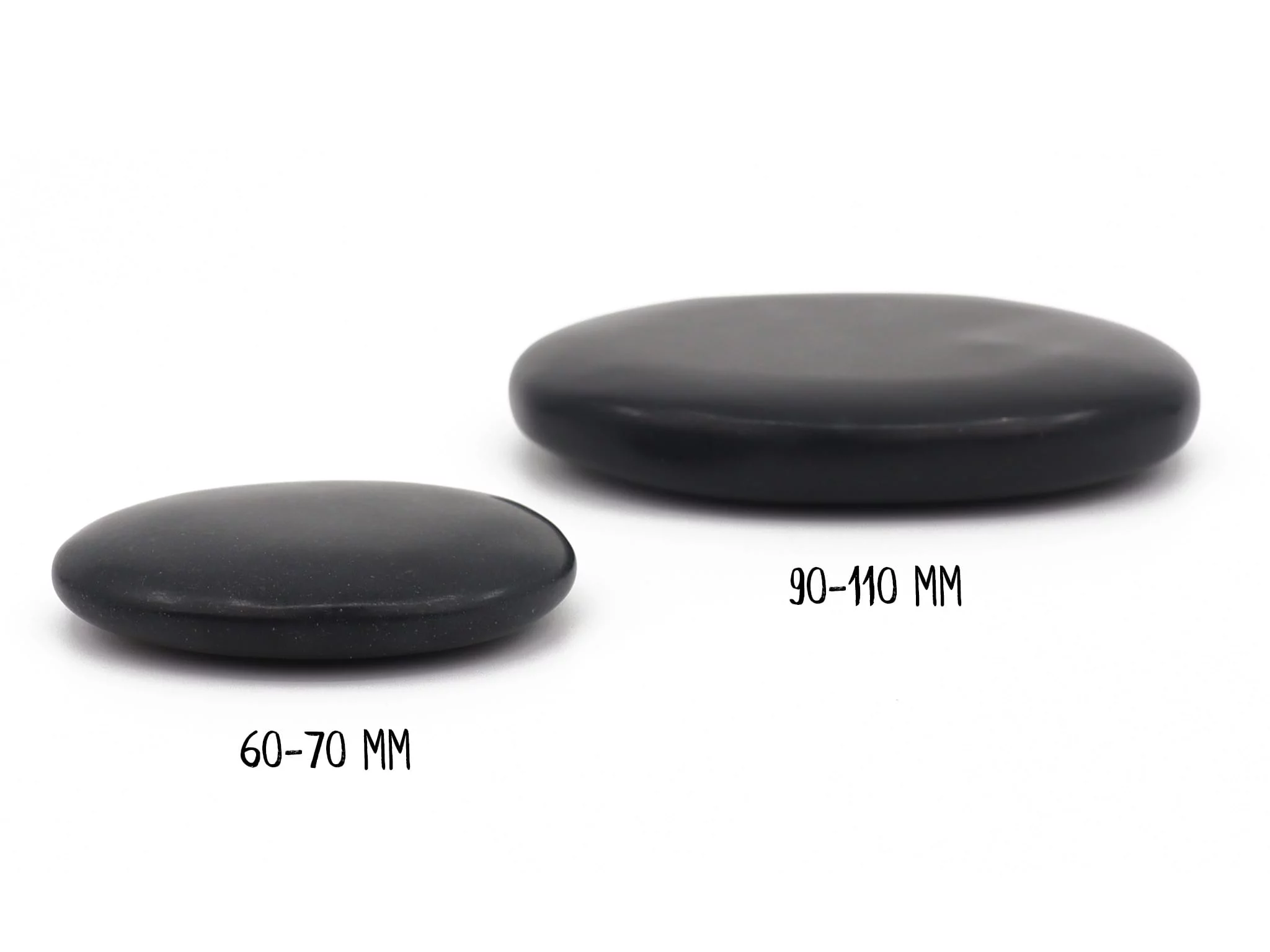 Basalt Hot Stone massage stones shown from the side, with sizes 60–70 mm and 90–110 mm