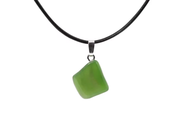 Jade nephrite gemstone pendant with green polished stone and silver eyelet on a black necklace