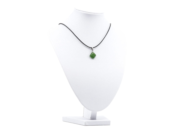 Jade nephrite gemstone pendant as a full view on a white jewelry bust with a black cord