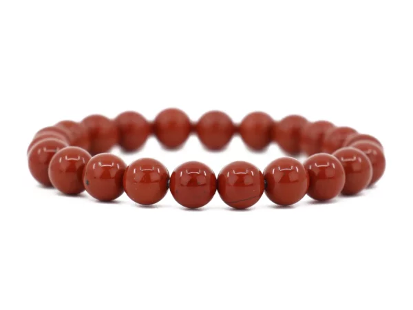 Red Jasper gemstone bracelet with shiny beads in full view on a white background