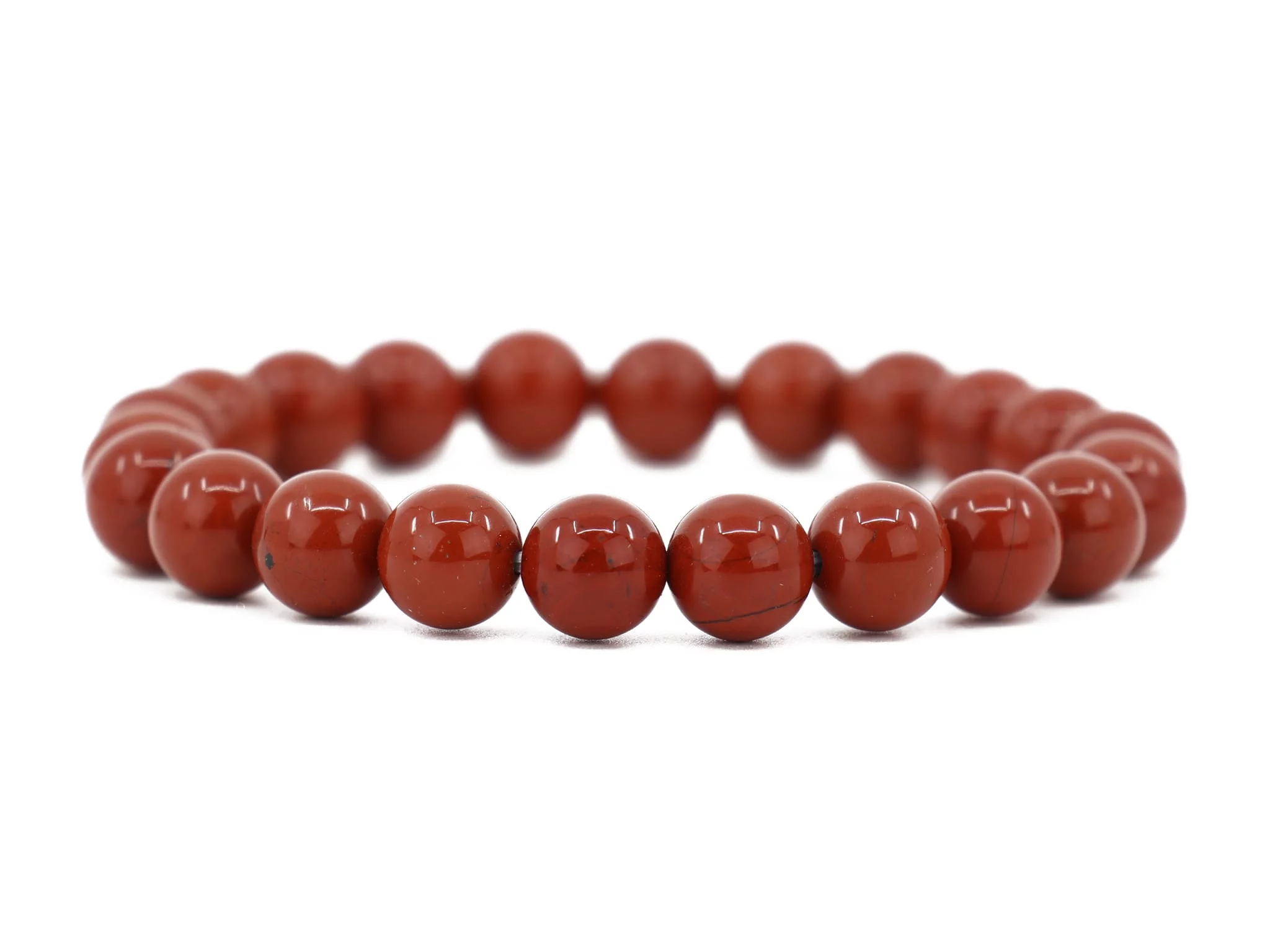 Red Jasper gemstone bracelet with shiny beads in full view on a white background