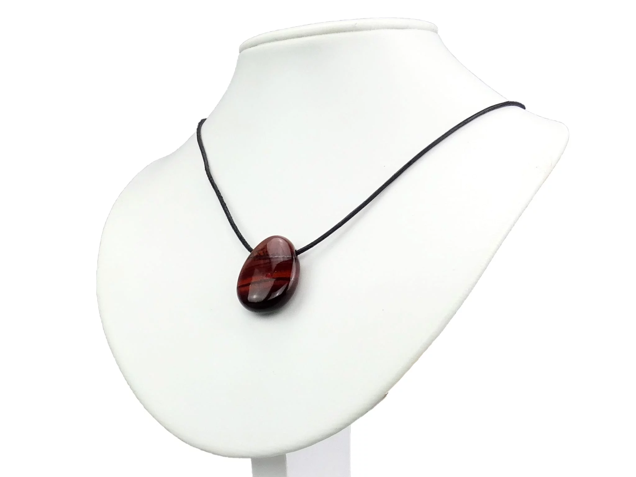 Cat's Eye gemstone pendant as a necklace on a white jewelry bust stand
