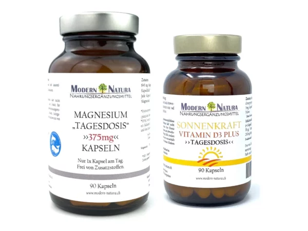 Capsules de magnésium et de vitamine D3 dans deux flacons en verre brun avec couvercles argentés sur fond blanc
