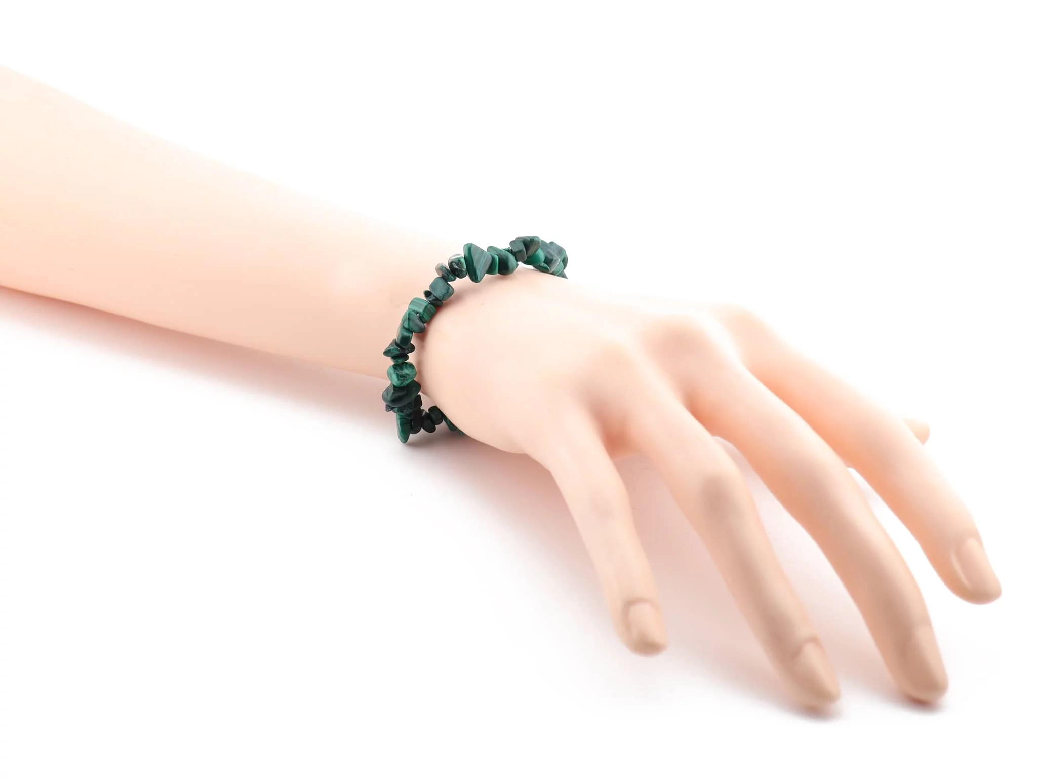 Malachite chip gemstone bracelet shown worn on the wrist on a white background