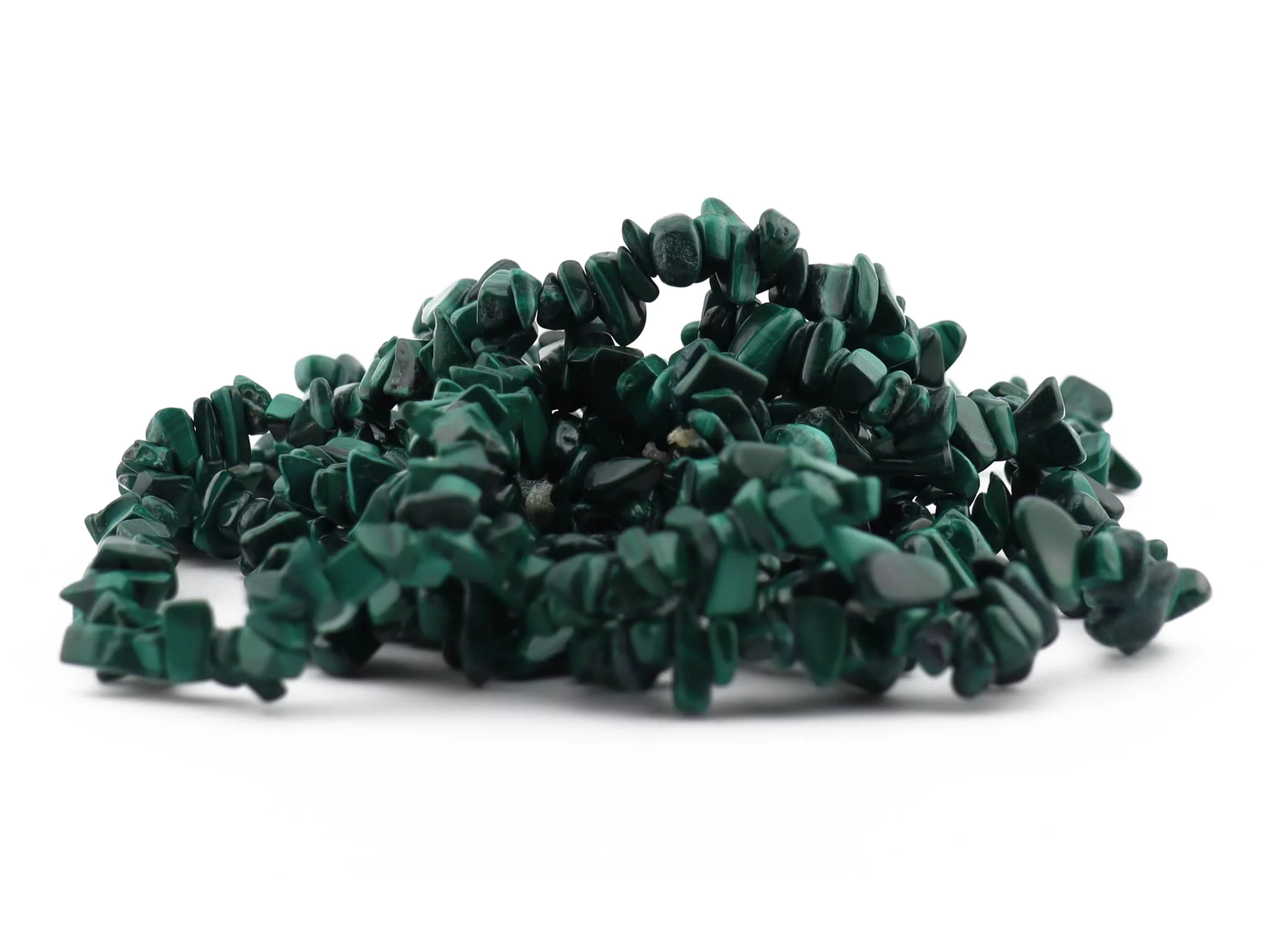 Malachite chip gemstone bracelet layered multiple times with rounded green stones
