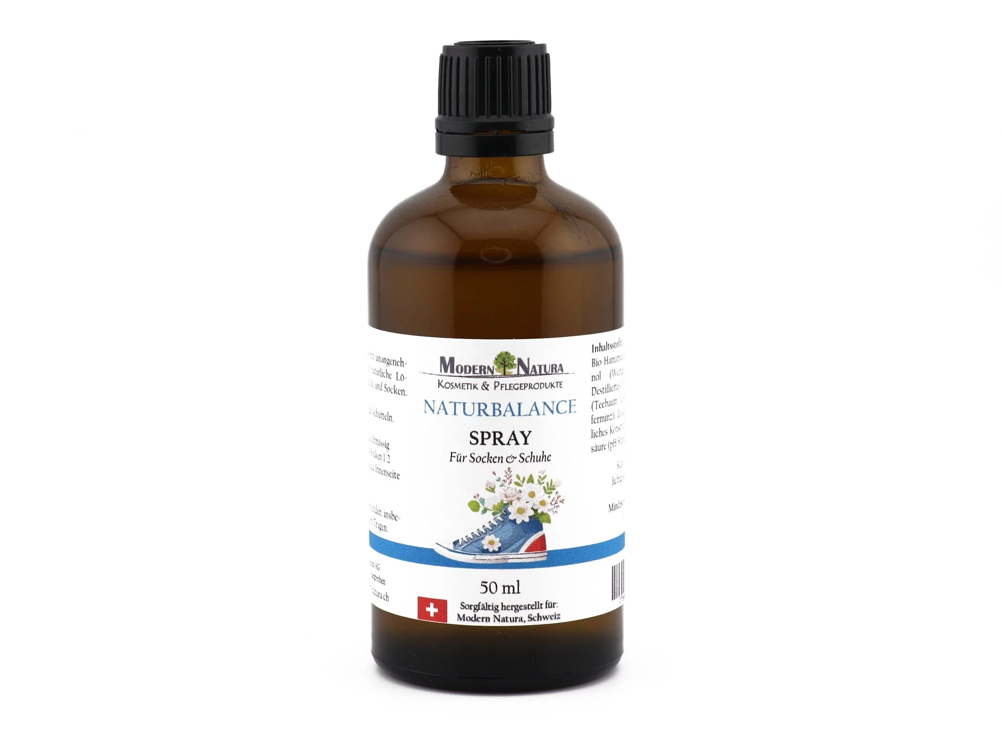 NaturBalance shoe and sock spray in an amber glass bottle with a black spray cap in front of a white background