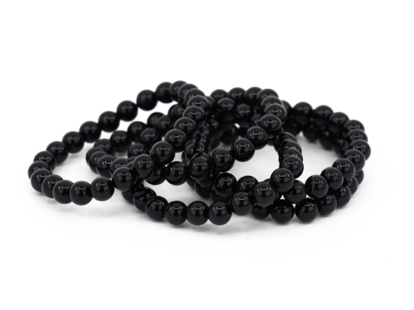 Bracciale in onice con diversi bracciali intrecciati e sfere nere lucide