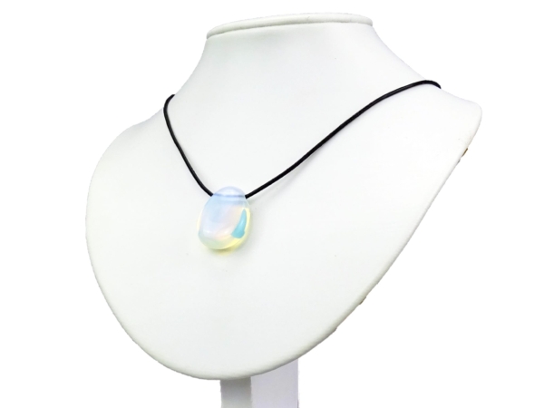 Opalite gemstone pendant on a black necklace on a white jewelry bust