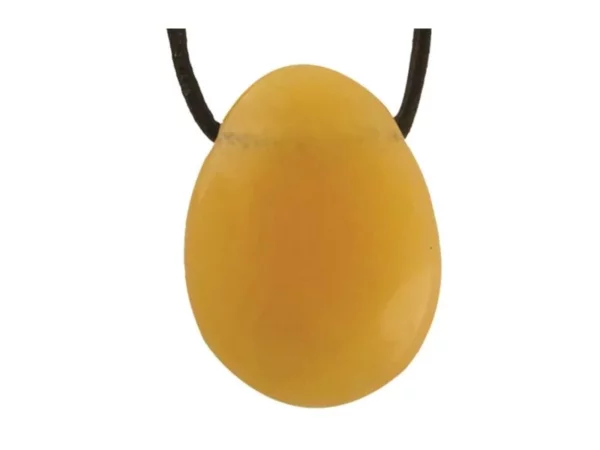 Orange calcite gemstone pendant in oval shape with black necklace on white background