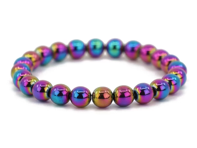 Rainbow hematite gemstone bracelet with iridescent beads in an oval overall view on a white background
