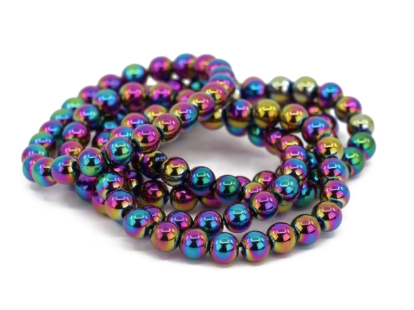 Rainbow hematite gemstone bracelets with multi-colored shimmering beads arranged on top of each other