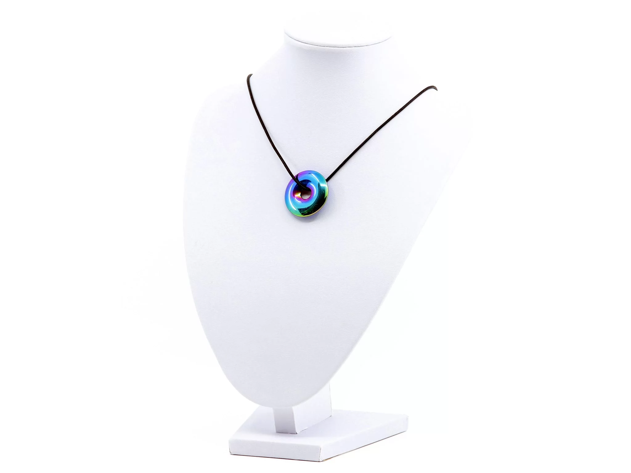 Rainbow hematite donut pendant as wearing view on dark necklace on white jewelry stand