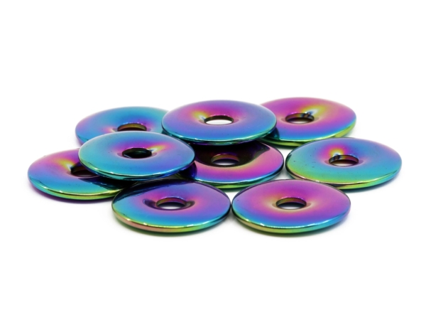 Rainbow hematite donuts with iridescent surface in flat side view on white background