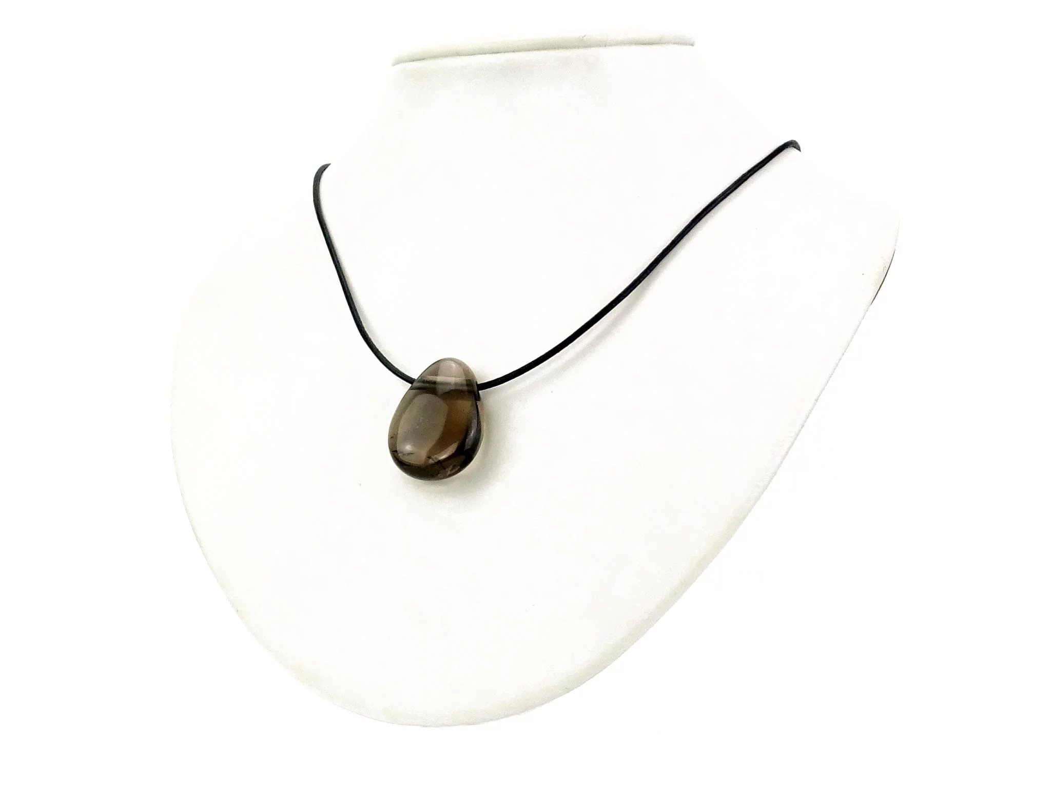 Smoky quartz gemstone pendant as a necklace on a white jewelry bust background