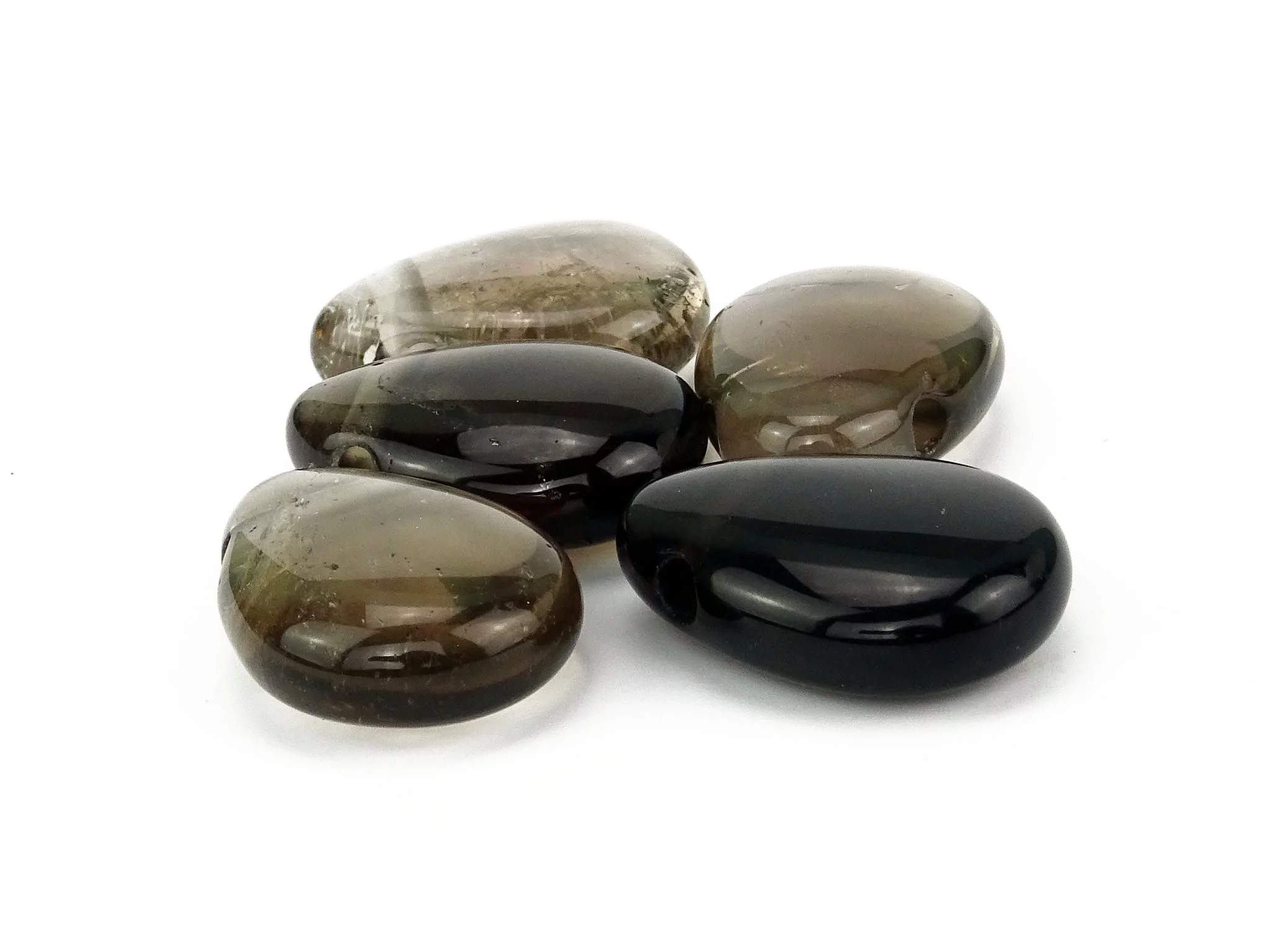 Smoky quartz gemstone pendant as a selection of polished stones in brown and black shades