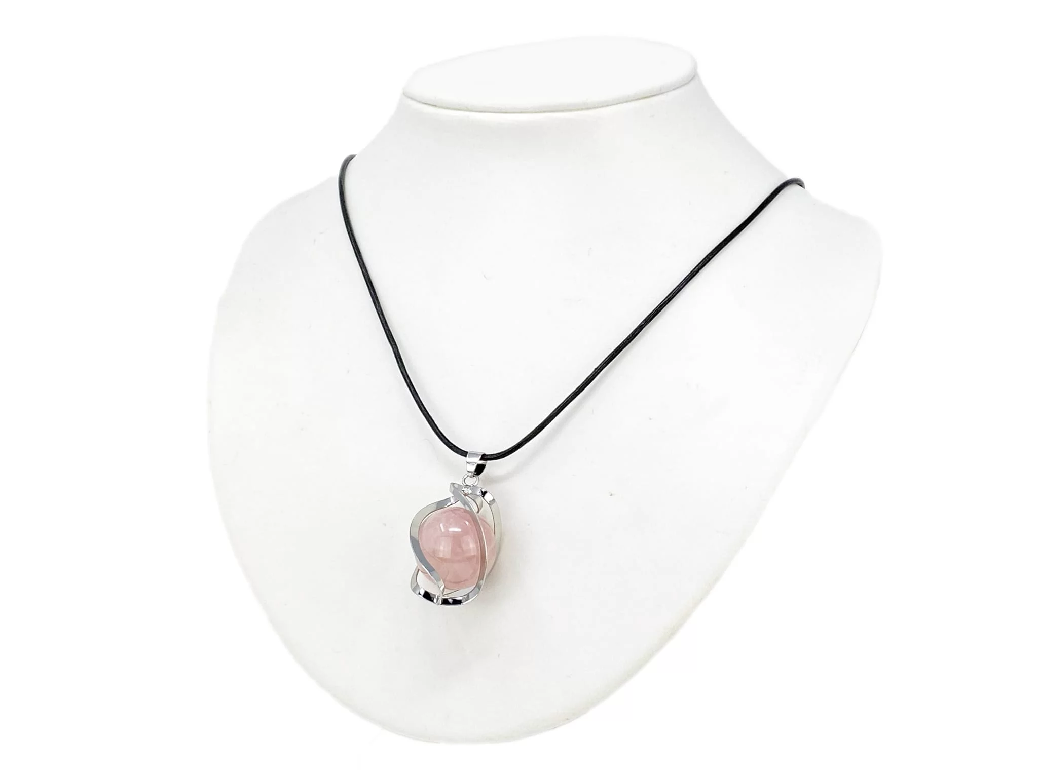 Rose quartz sphere pendant worn on a black necklace on a white jewelry bust