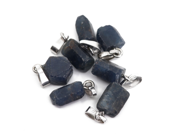 Sapphire natural crystal pendant with shiny 925 silver eyelets in a group view