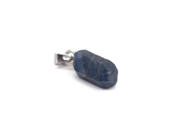 Sapphire natural crystal pendant as a lateral close-up of the raw surface