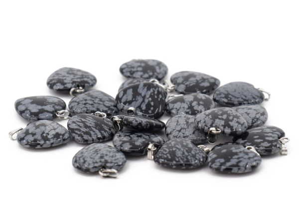 Snowflake obsidian heart pendant showing a selection of several grey-patterned natural stones