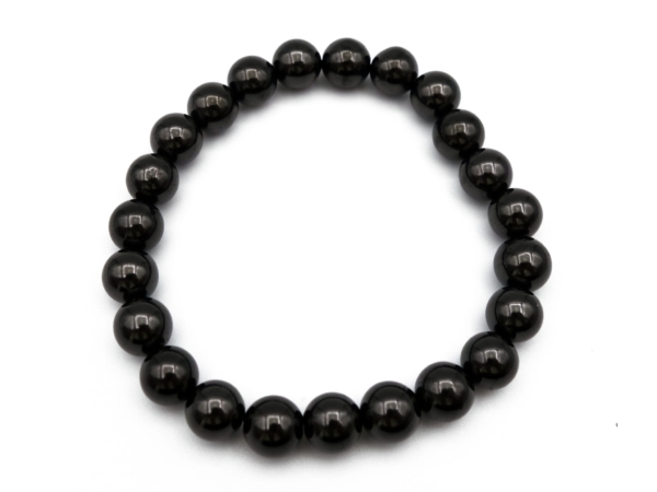 Bracciale di Shungite con sfere nere levigate in vista dall'alto come cerchio chiuso