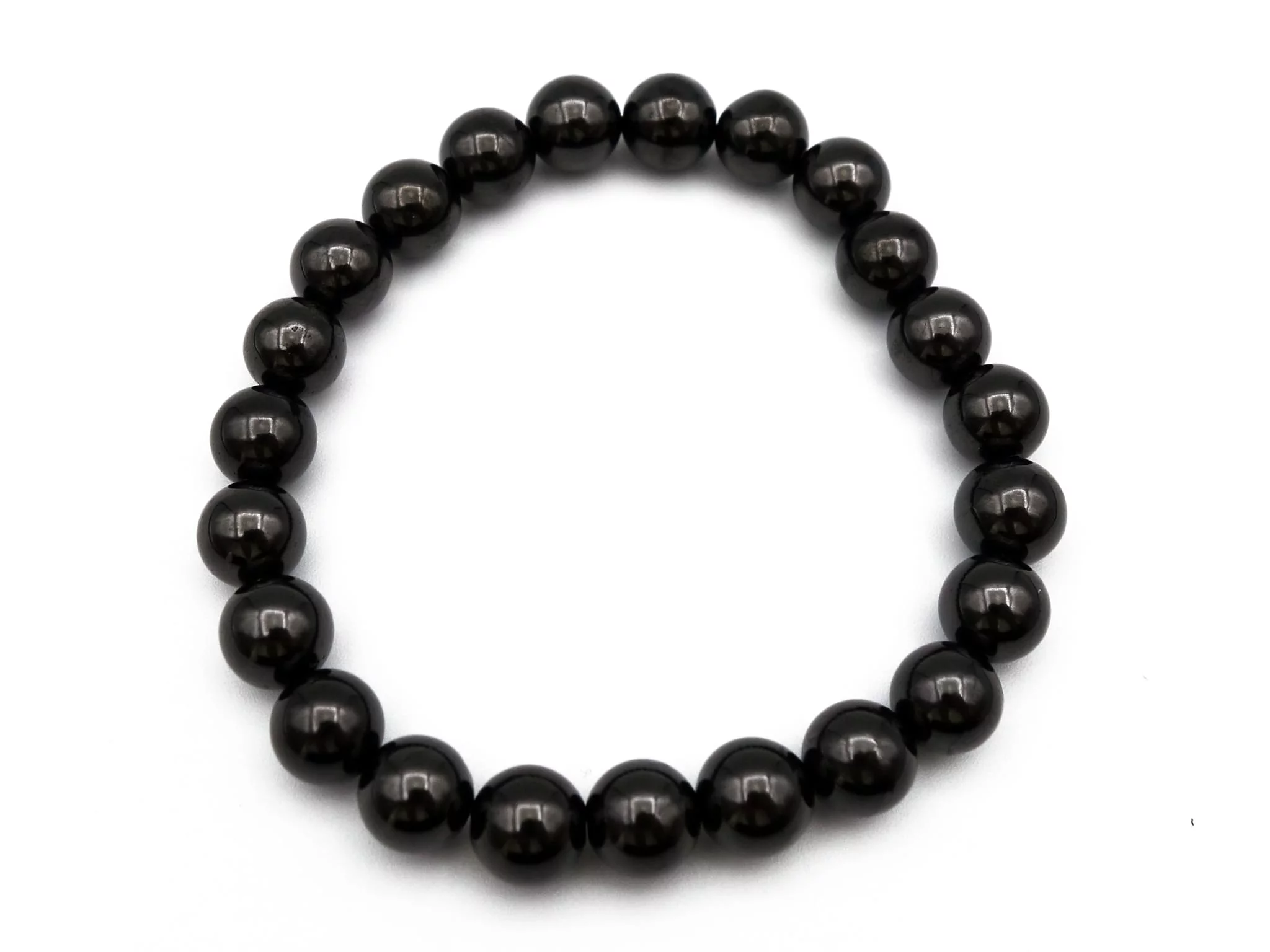 Shungite bracelet with black, polished beads, top view as a closed circle