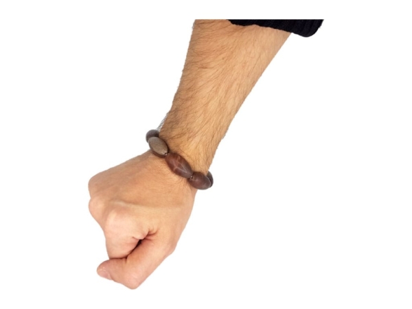 Shiva Lingam bracelet shown worn on the wrist with elongated brown gemstones