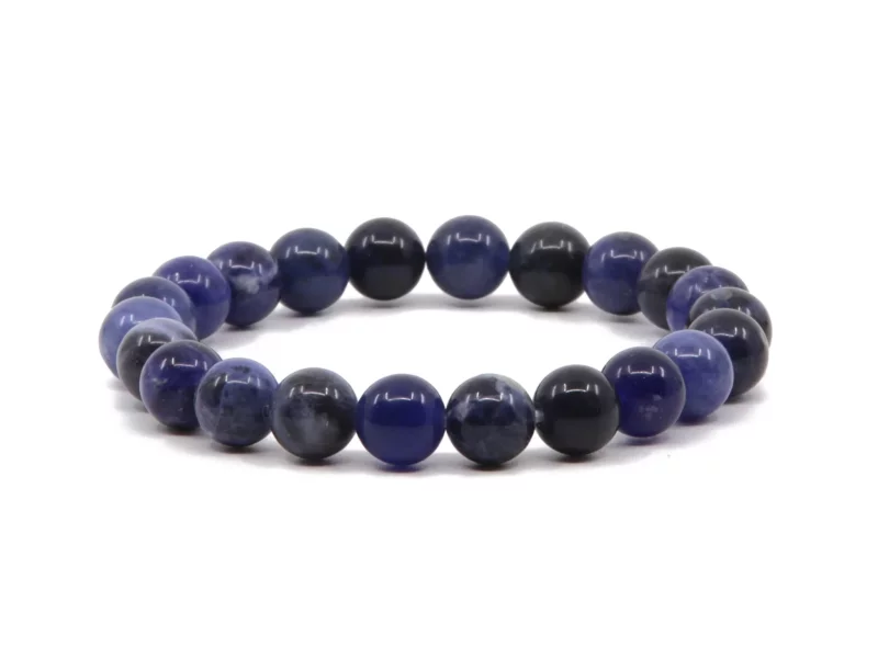 Sodalite gemstone bracelet with polished dark blue beads in full front view on a white background