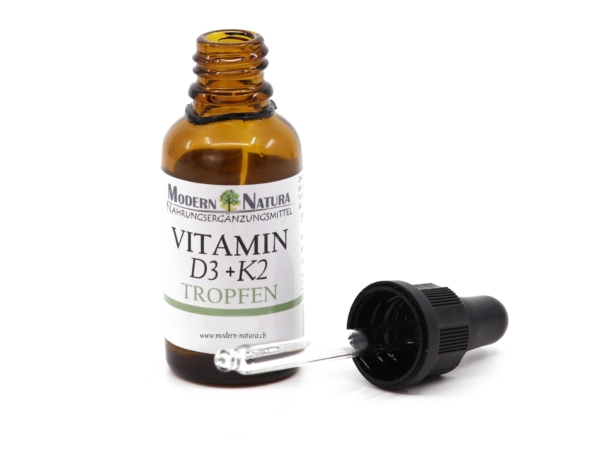 Vitamin D3 + K2 Drops with opened amber glass bottle and separate glass pipette