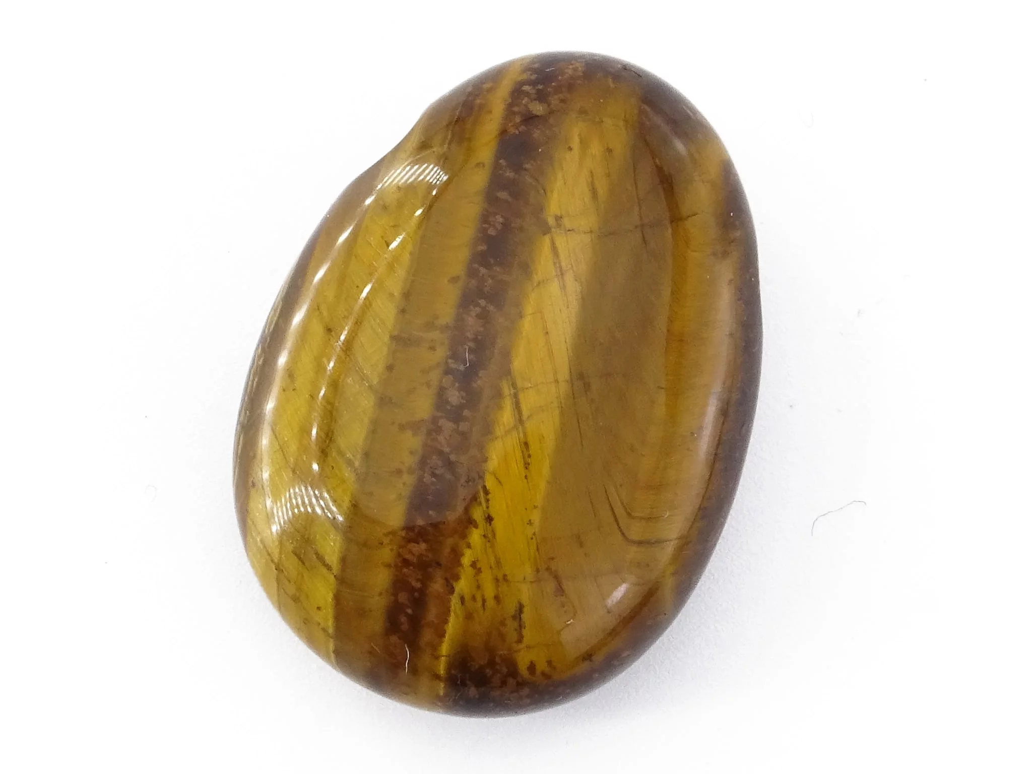 Close-up of tiger's eye gemstone pendant with shiny golden-brown stripes
